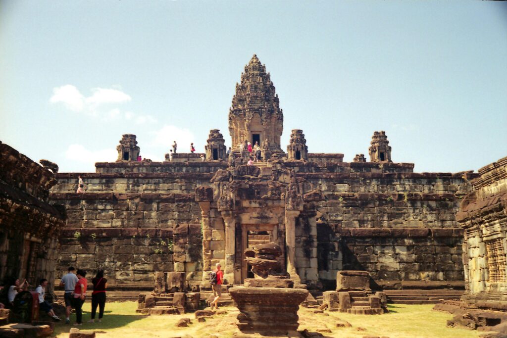 The five-tiered pyramid of Bakong temple, surrounded by moats and towers