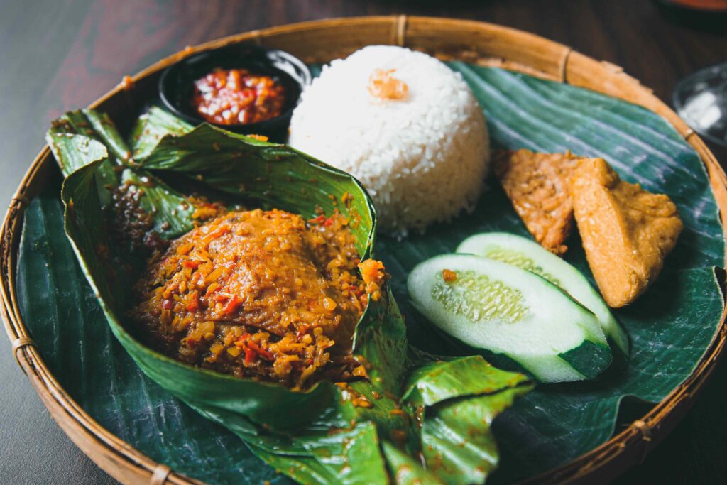Plant-Based Nasi Campur in Bali Colorful plate of vegan nasi campur in traditional Balinese style