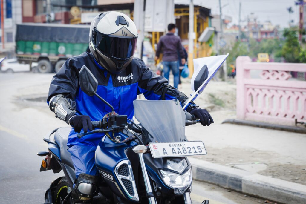 Motorbike safety in Southeast Asia Motorbike rider wearing helmet in Southeast Asian traffic