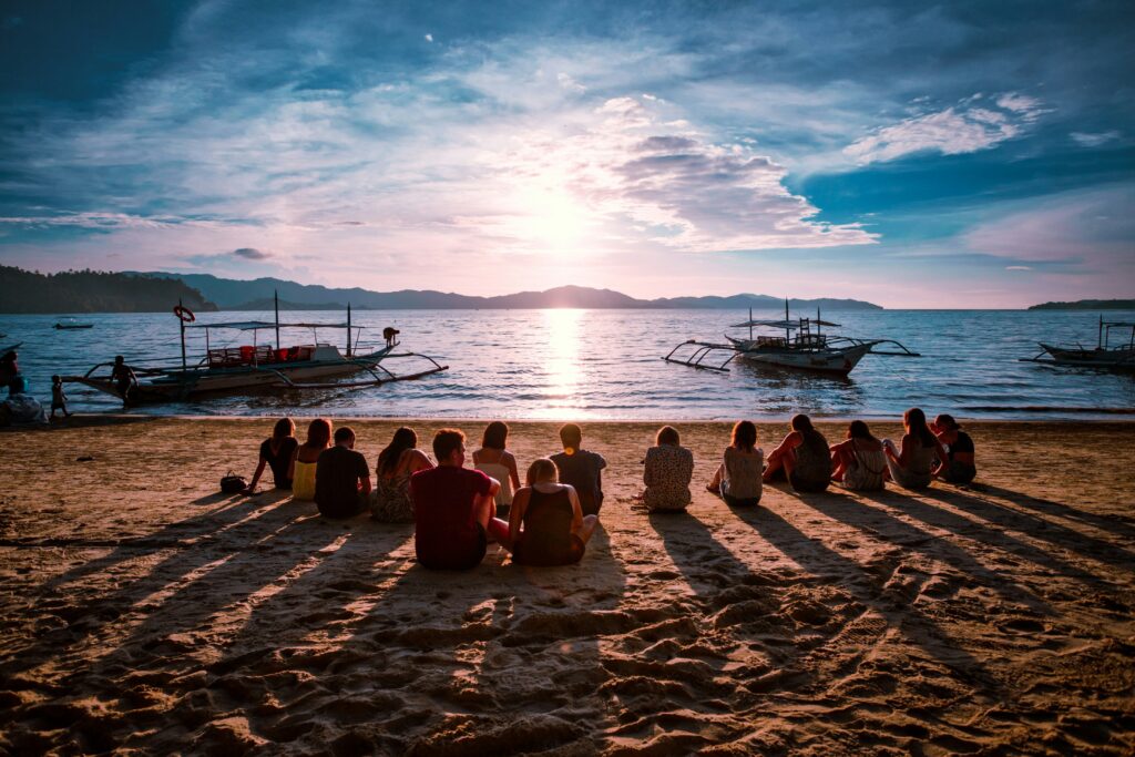 Peaceful end to a safe trip Relaxed traveler watching sunset in Southeast Asia after a safe journey