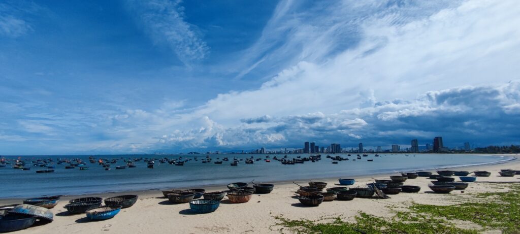 Traditional basket boats on the beach in Da Nang, capturing local life along one of the best travel routes in Vietnam